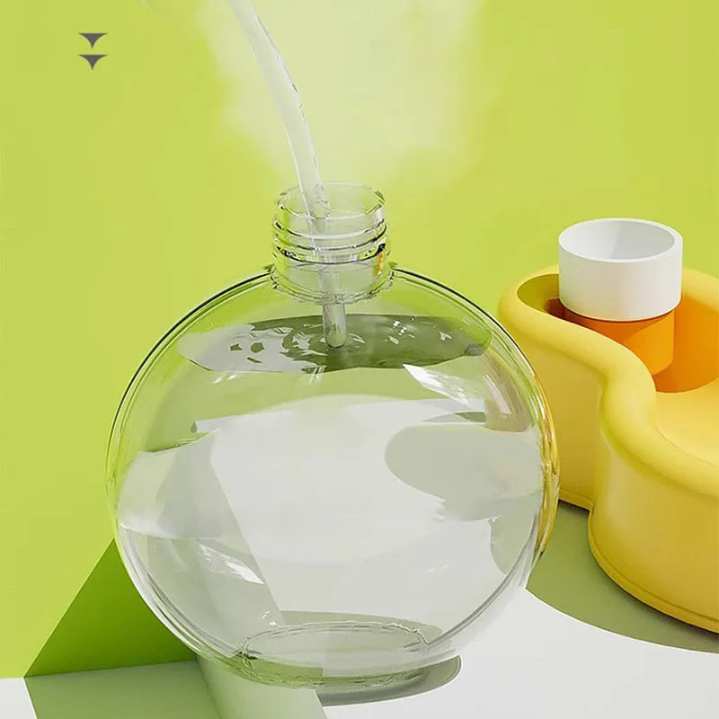 Green portable dog water bottle with integrated drinking bowl for travel and outdoor use
