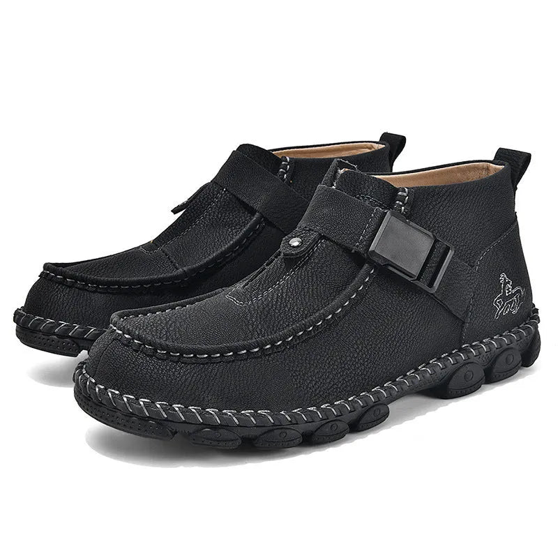 Casual black slip-on shoes with handmade stitching and a flat, low-heel sole.