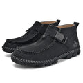 Casual black slip-on shoes with handmade stitching and a flat, low-heel sole.