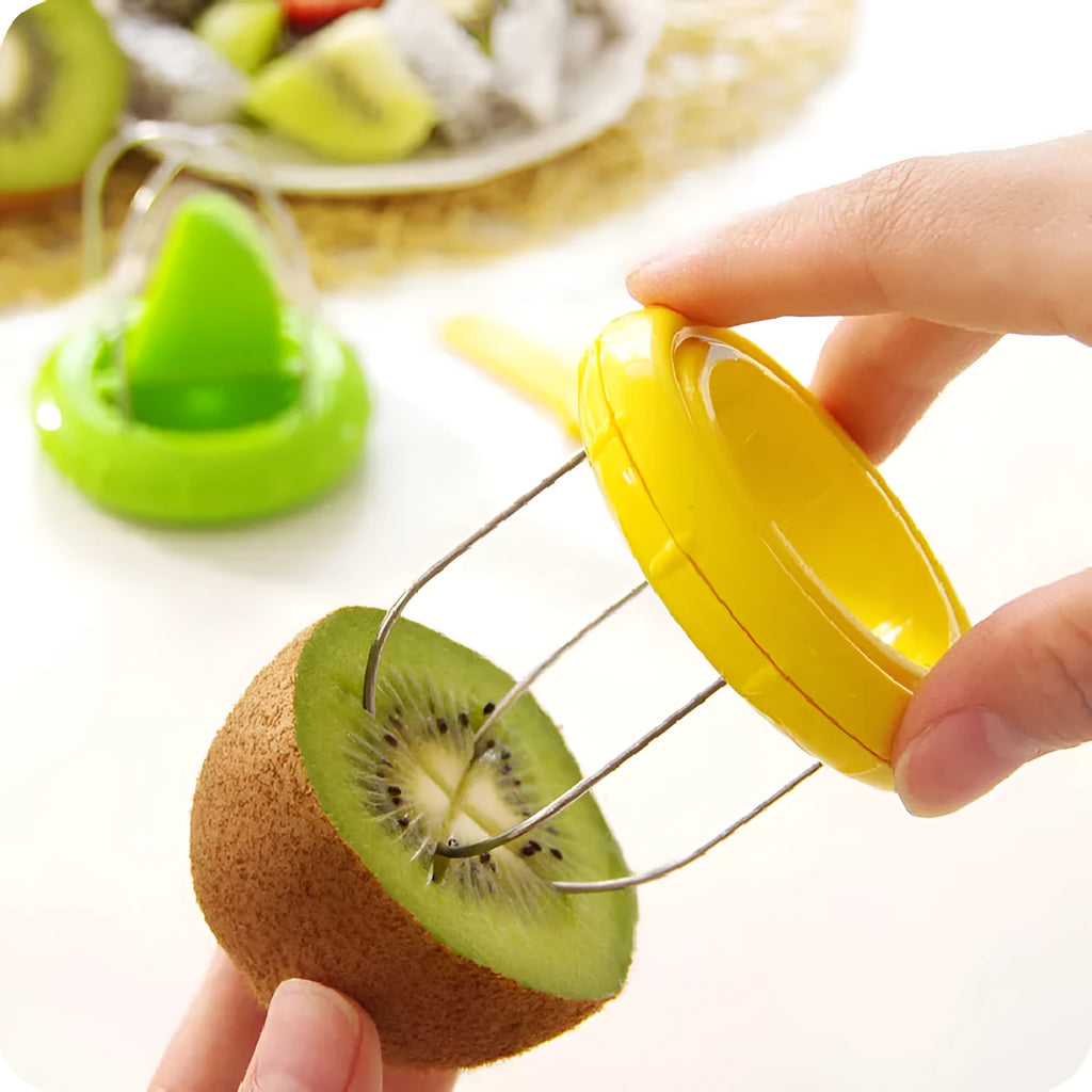 Mini kiwi fruit cutter peeler slicer on table showing compact size and stainless steel blade