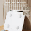 White smart body fat scale with 8 electrodes and a large LED display on a tempered glass platform.