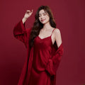 Red long-sleeved ice silk sleepwear set for a man and woman laid out flat.