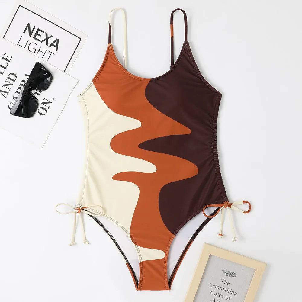 Women's sleeveless one-piece swimsuit in a choice of blue, purple, brown, or green colours.