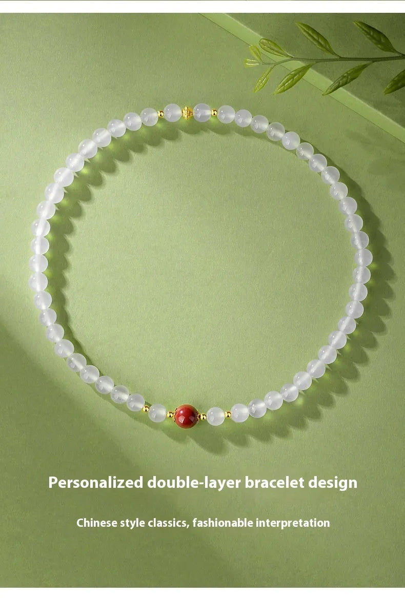 White agate women's bracelet with geometric double layer design featuring jequirity bean and cinnabar accents