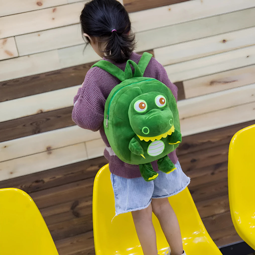 Soft plush dinosaur backpack for children with embroidery detailing in blue colour