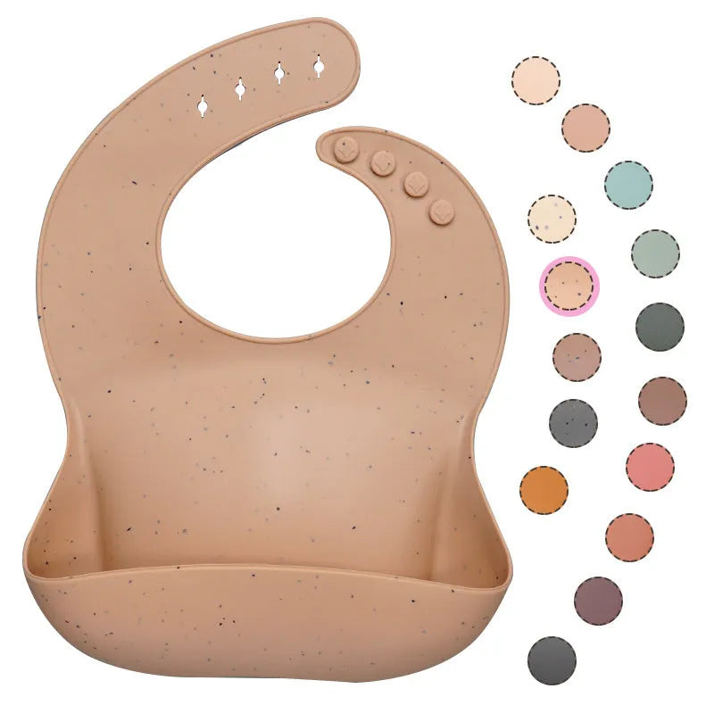 Soft waterproof silicone baby bib with food catcher in pink, with adjustable neck closure