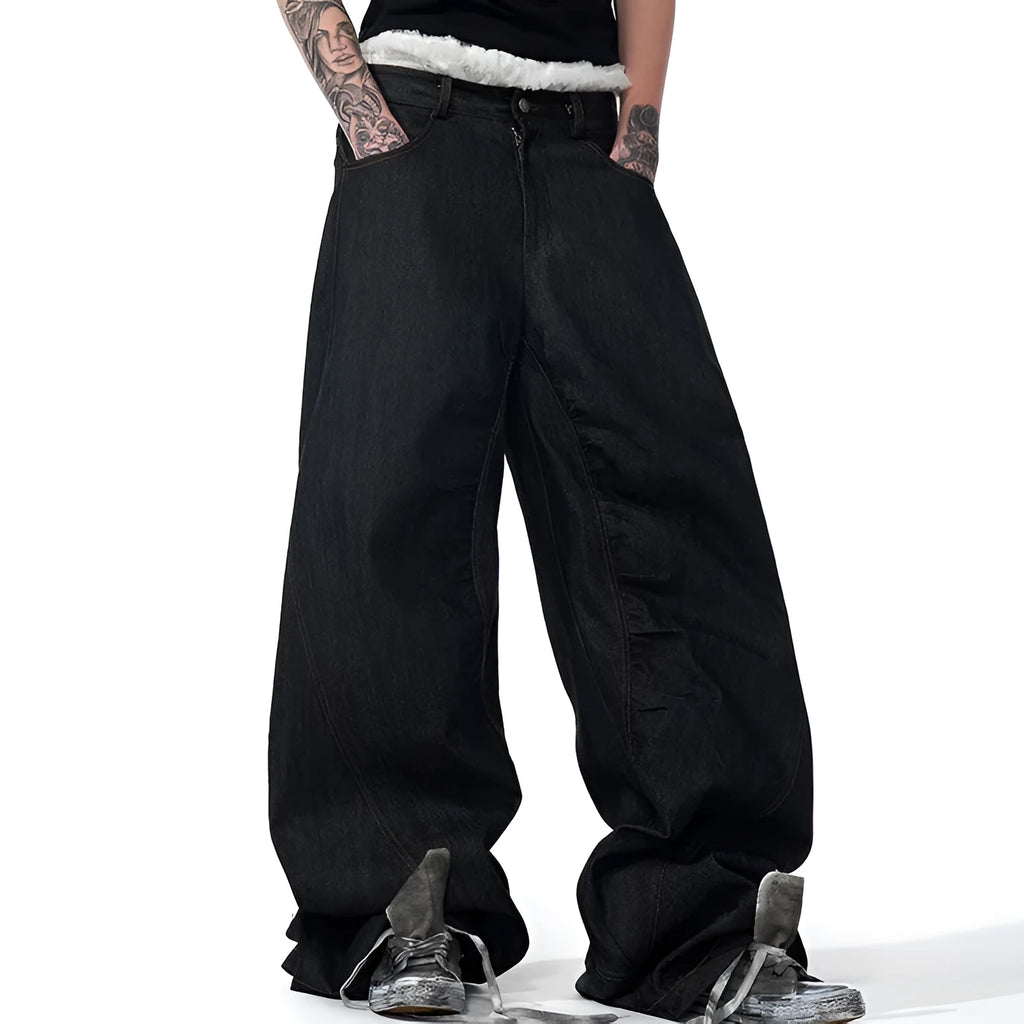 Black wide leg jeans with colour-changing temperature-sensitive embroidery and red ear detailing on a hanger.