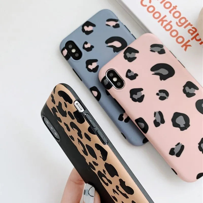 Leopard print phone case for iPhone in black, blue, and pink colours showing front and back views.