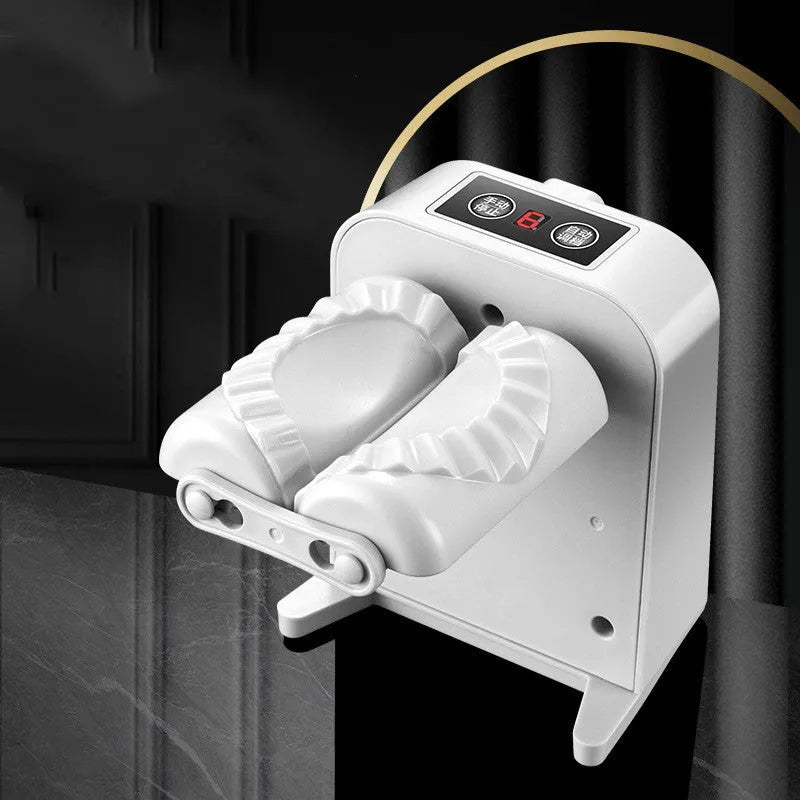 White electric dumpling maker machine with USB charging cable and accessories on kitchen counter