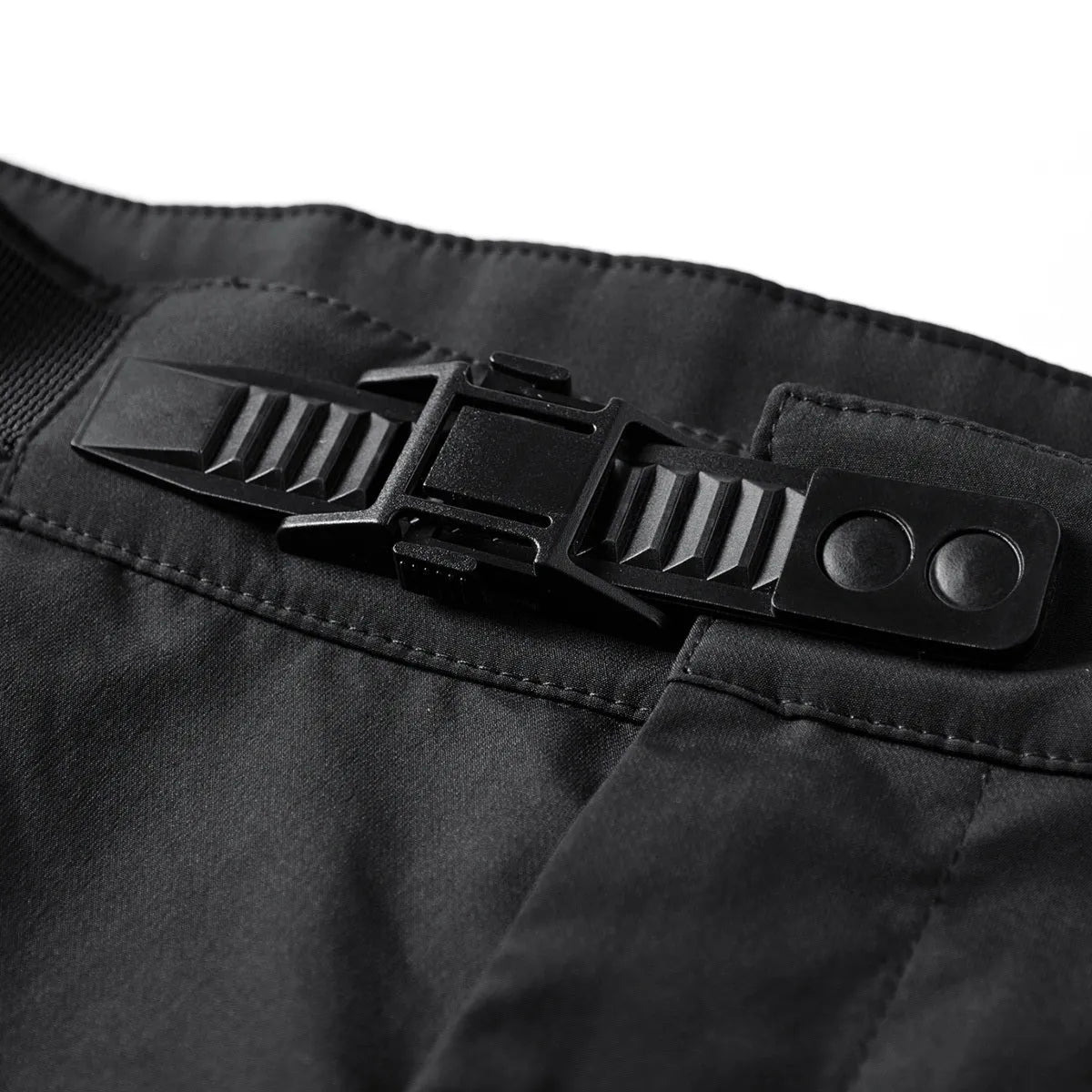 Men's black multi pocket parachute pants loose fit with mid waist and wrinkle-resistant polyester fabric