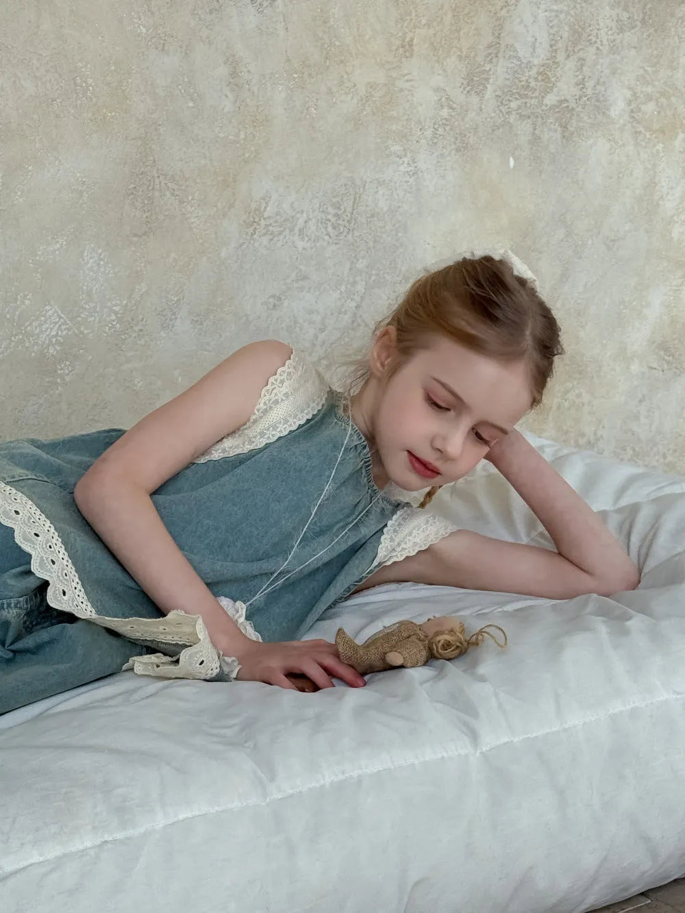 Light blue girls' lace trim denim cropped wide-leg pants and sleeveless vest two-piece set on child model