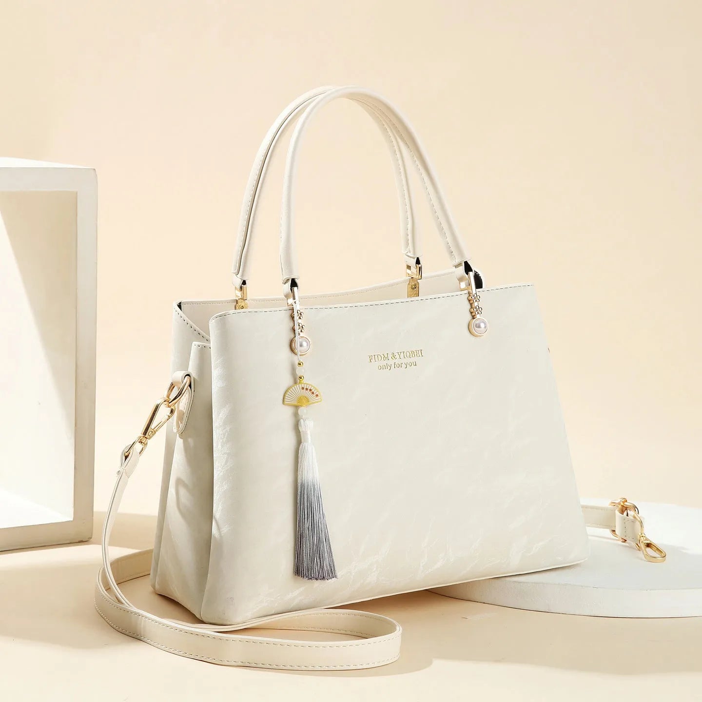 Women's square shoulder bag in PU leather with ethnic detailing and slit pocket
