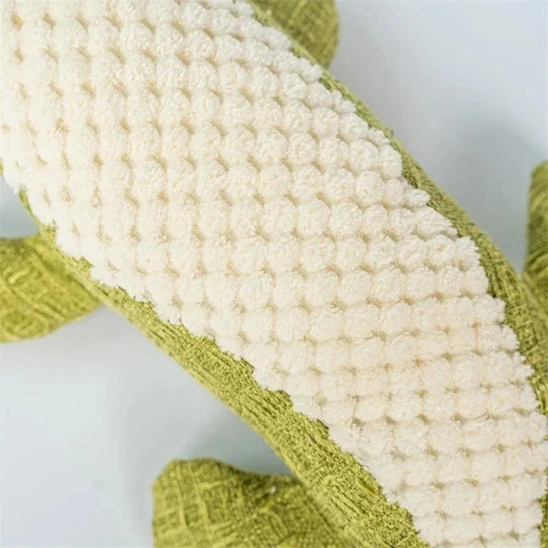 Blue, green, and red corn-shaped plush pet toys with a grid texture on a white background