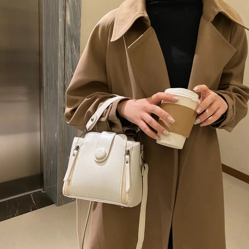 PU shoulder crossbody bag in white, blue or black with adjustable strap and retro street style