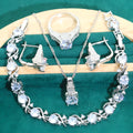 Four-piece bridal jewellery set with zircon details, water wave chains, and alloy pendants in presentation