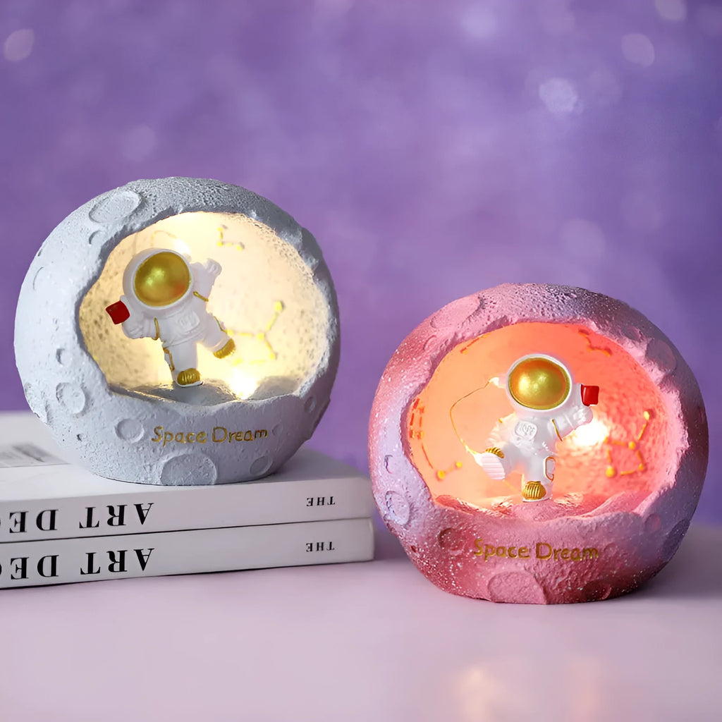 Cartoon spaceman synthetic resin night light ornament in astronaut design on a table