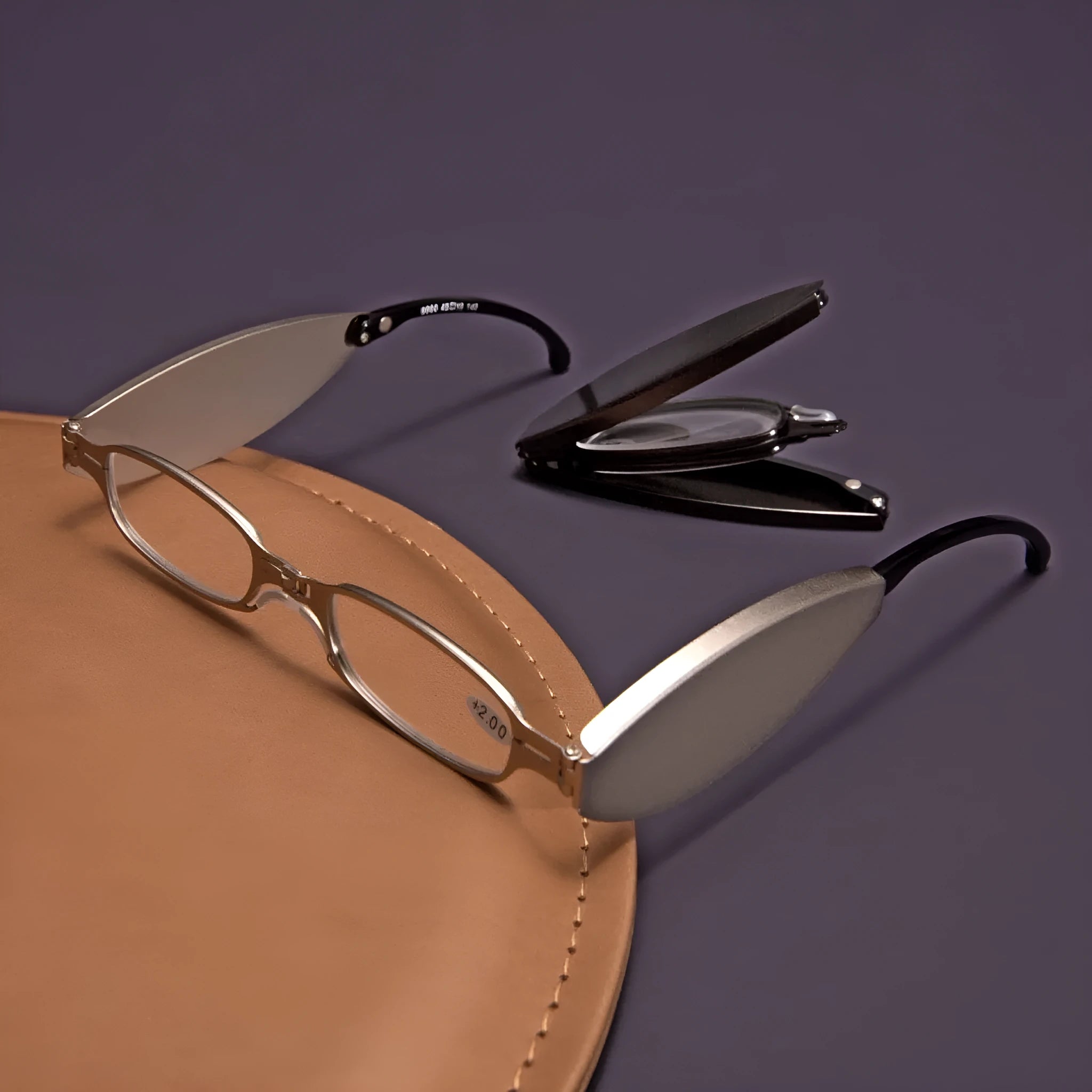 Folding presbyopic reading glasses in retro style with ring detailing, shown in black frame