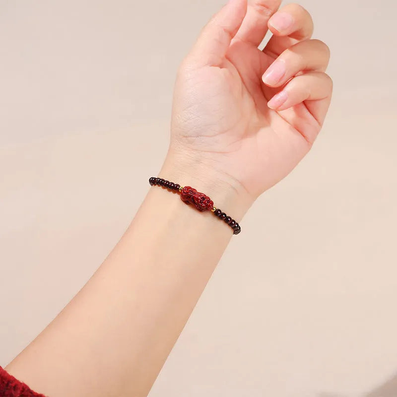 Geometric square garnet bracelet with strawberry quartz and purple sand pixiu charm.