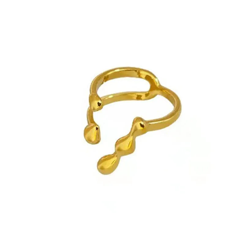 Adjustable brass ring with sphere design in gold or silver plating.