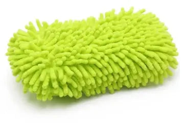 Silver green microfiber car wash sponge measuring 14x25cm on a car surface.