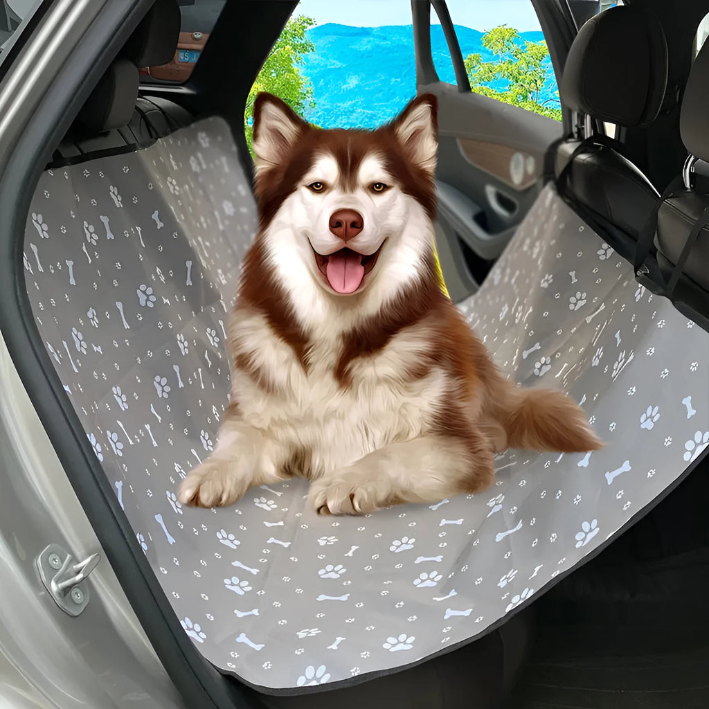 Water resistant dog car seat cover mat on a rear car seat in a bone print pattern.