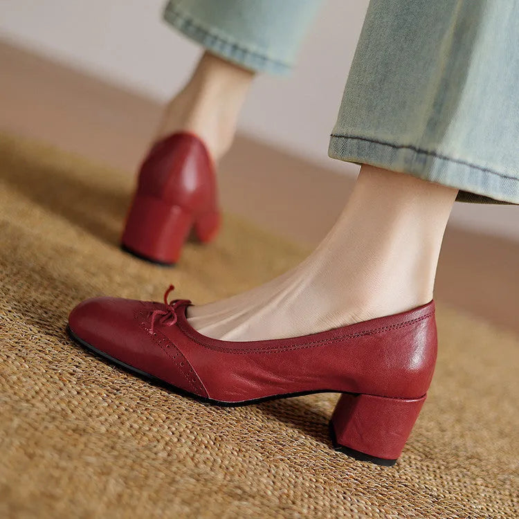 Women's round toe mid heel chunky leather pumps in solid colour with bow detail