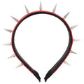 Punk rivet headband in black metal with tapered pointed nail spikes, unisex hair accessory on a solid background