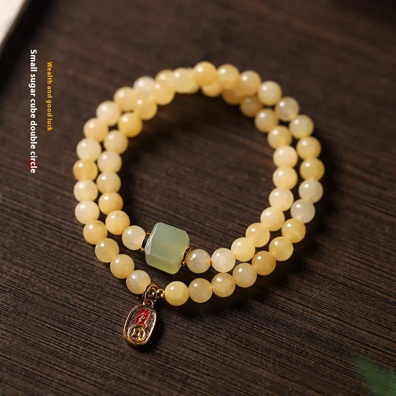 Women's hand-woven topaz bracelet with mantra barrel beads and square jade accents