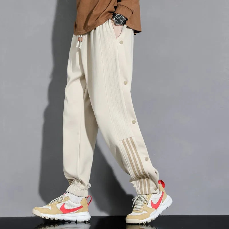 Men's loose black sweatpants with ankle ties and high elastic waistband for sports