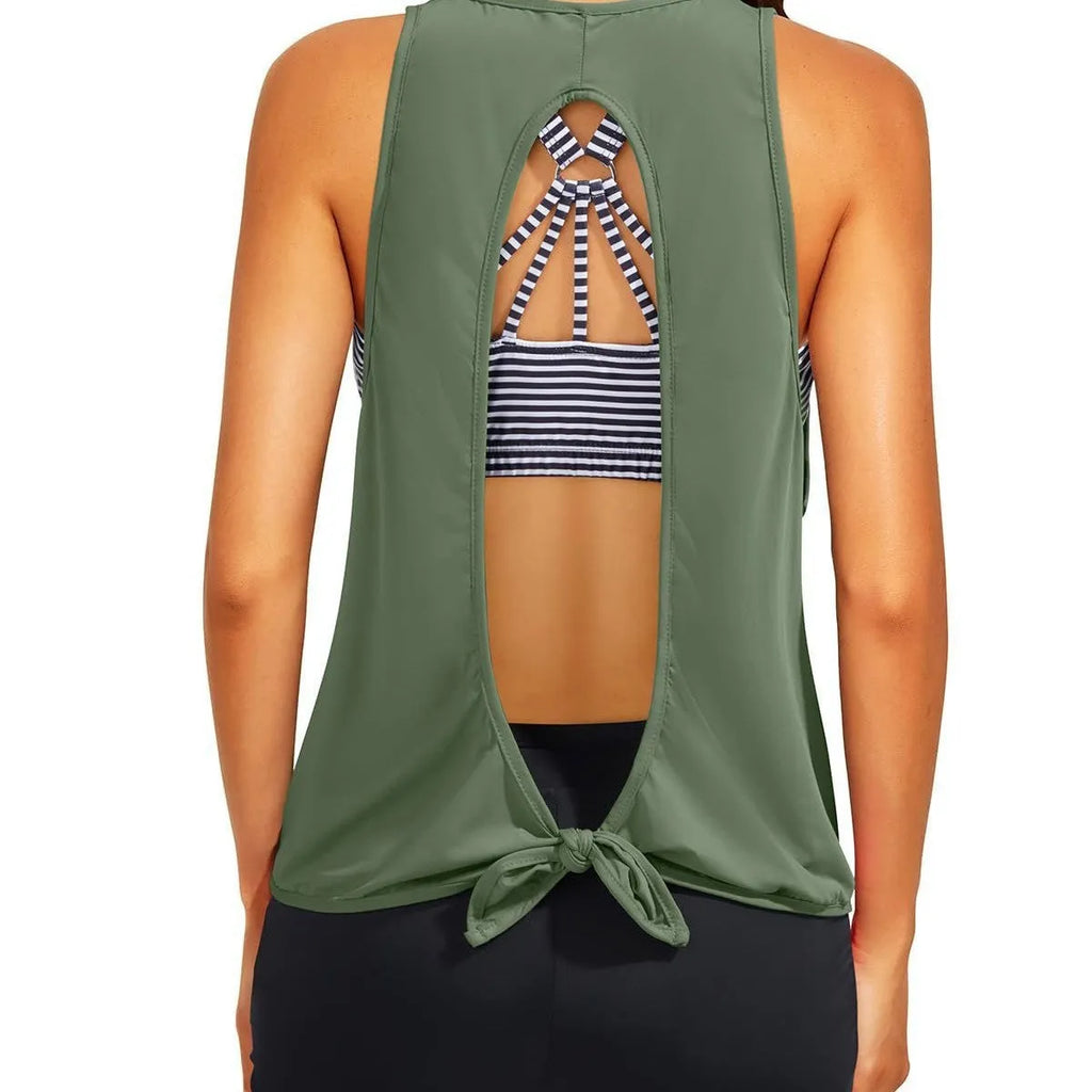 Women's printed three-piece swimsuit set with short sleeve top, vest, and shorts in peacock blue, showing hollow backless design and covered belly.