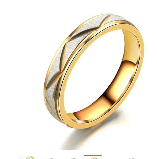 24K gold stainless steel couple ring with polished surface on display