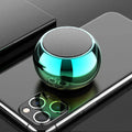 Small silver aluminium Bluetooth speaker showing USB port and compact size