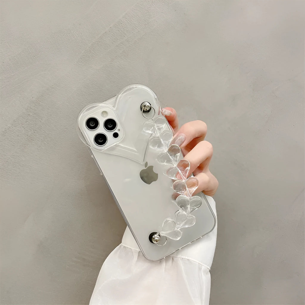 Transparent clear iPhone case with a love heart chain design on a smartphone.