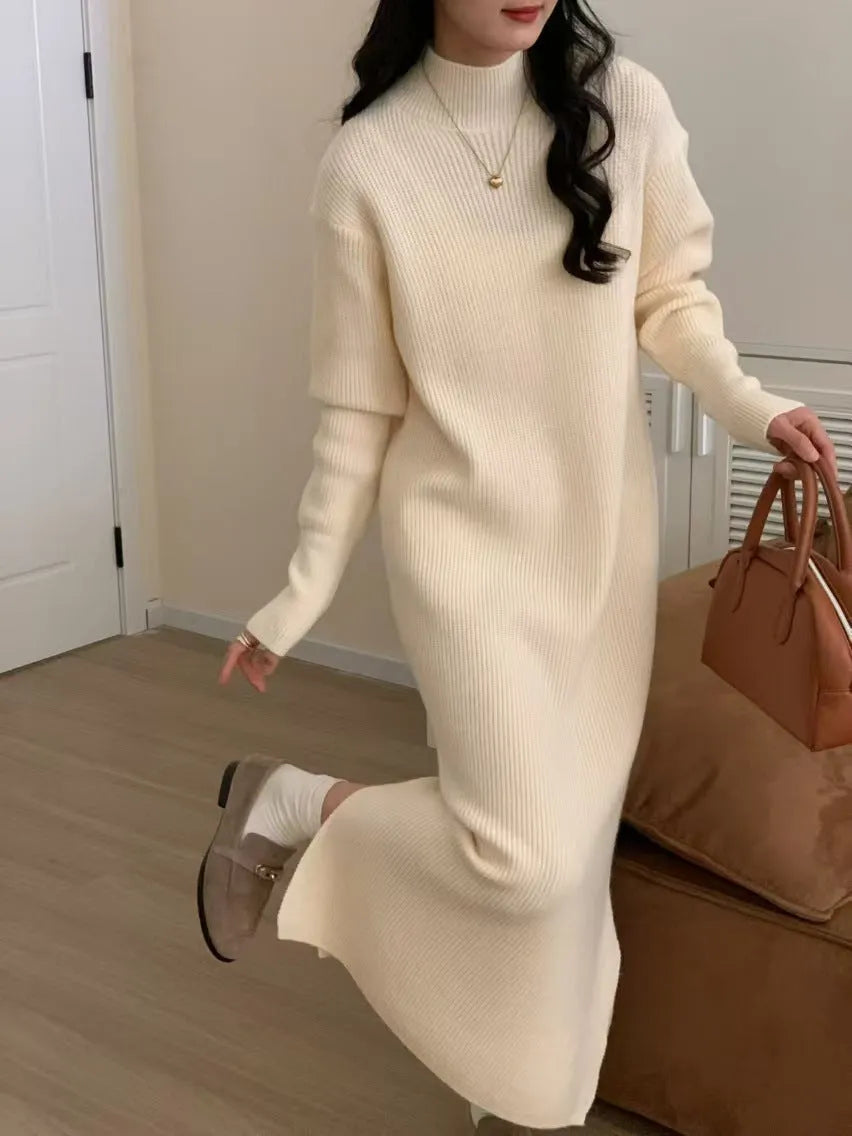 Acrylic knitted dress with half turtleneck, high waist, and midi length in solid colour