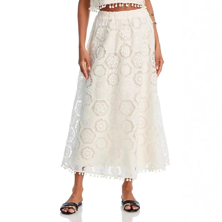 White women's retro style sleeveless top and long skirt suit set with embroidery detail.