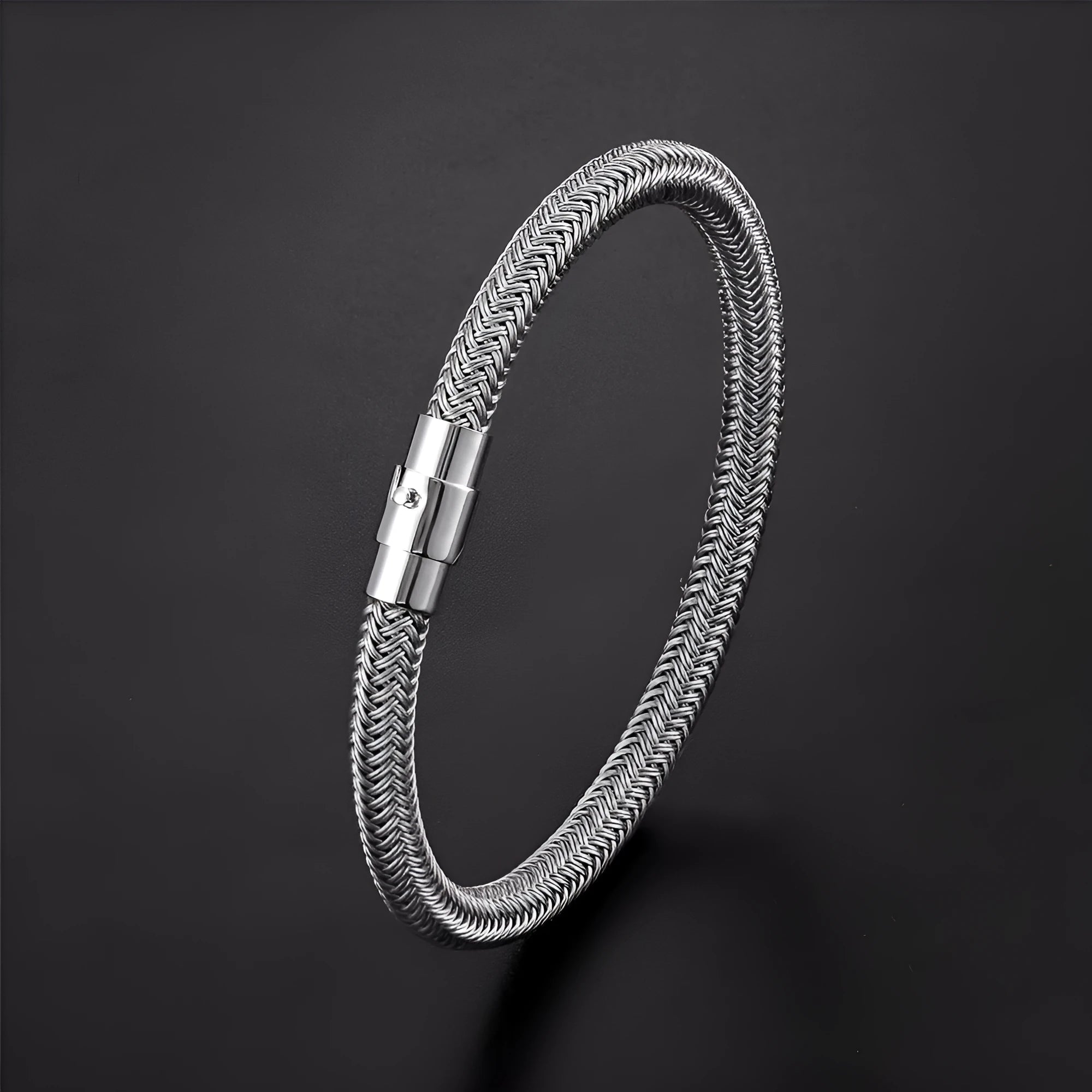 Titanium steel geometric wire bracelet with a magnet clasp shown in one of four colour options.