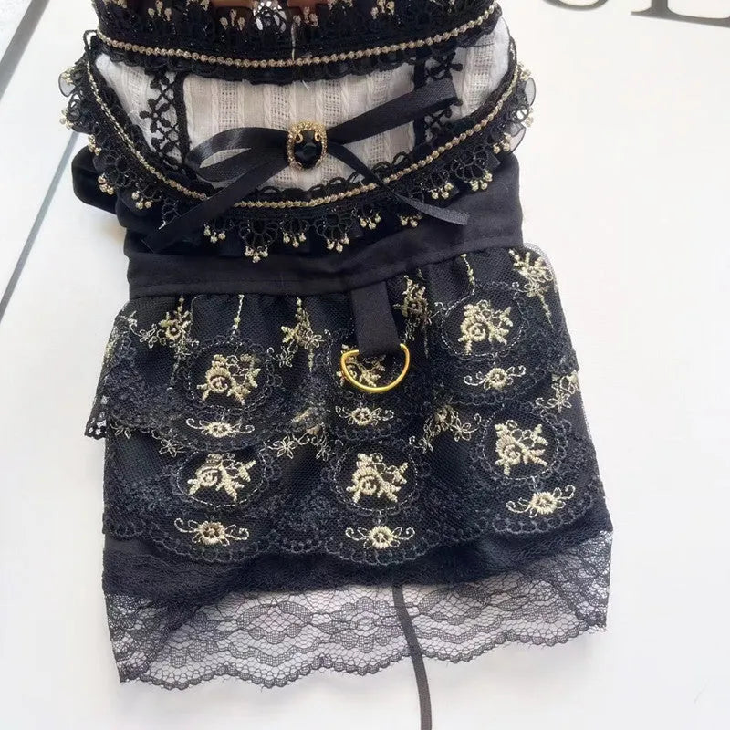 Golden gothic style skirt costume for a small dog or cat on a hanger.
