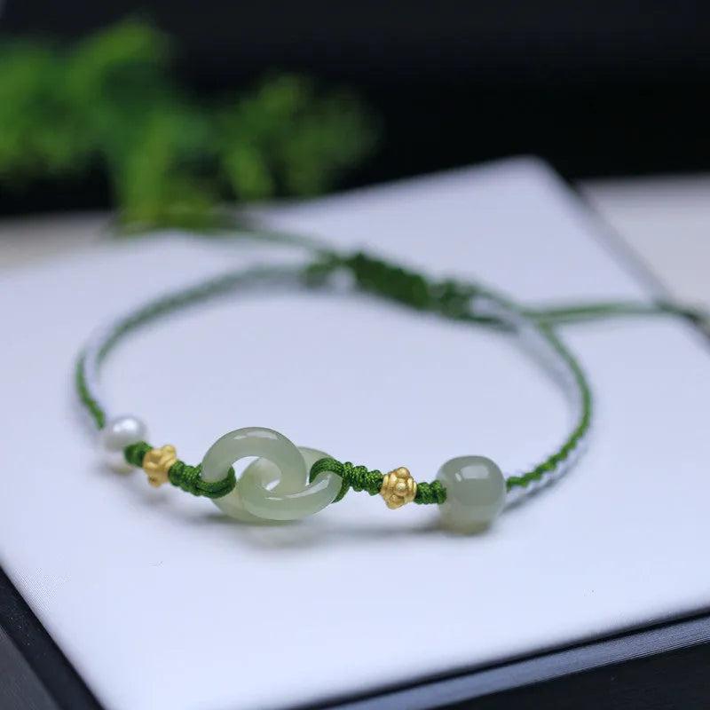 DIY woven bracelet with Hetian jade beads on a flexible wire band with silver or gold metal fittings.