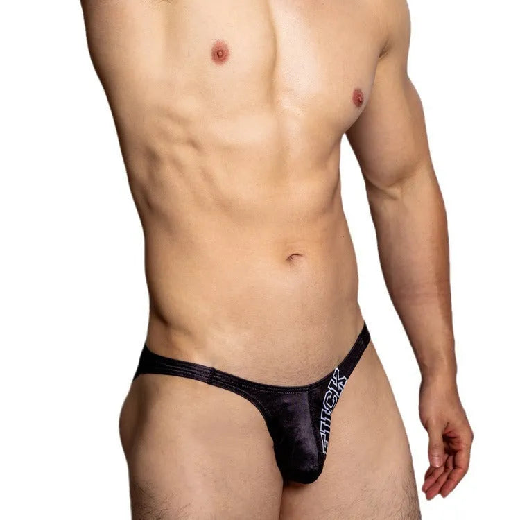 White low waist polyester triangle shorts laid flat, showing briefs style and plain weave fabric.