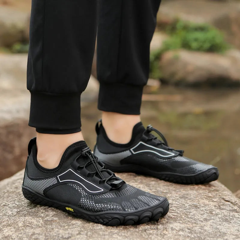 Pair of upstream shoes in 2303 Black with non-slip rubber sole and elastic fabric upper