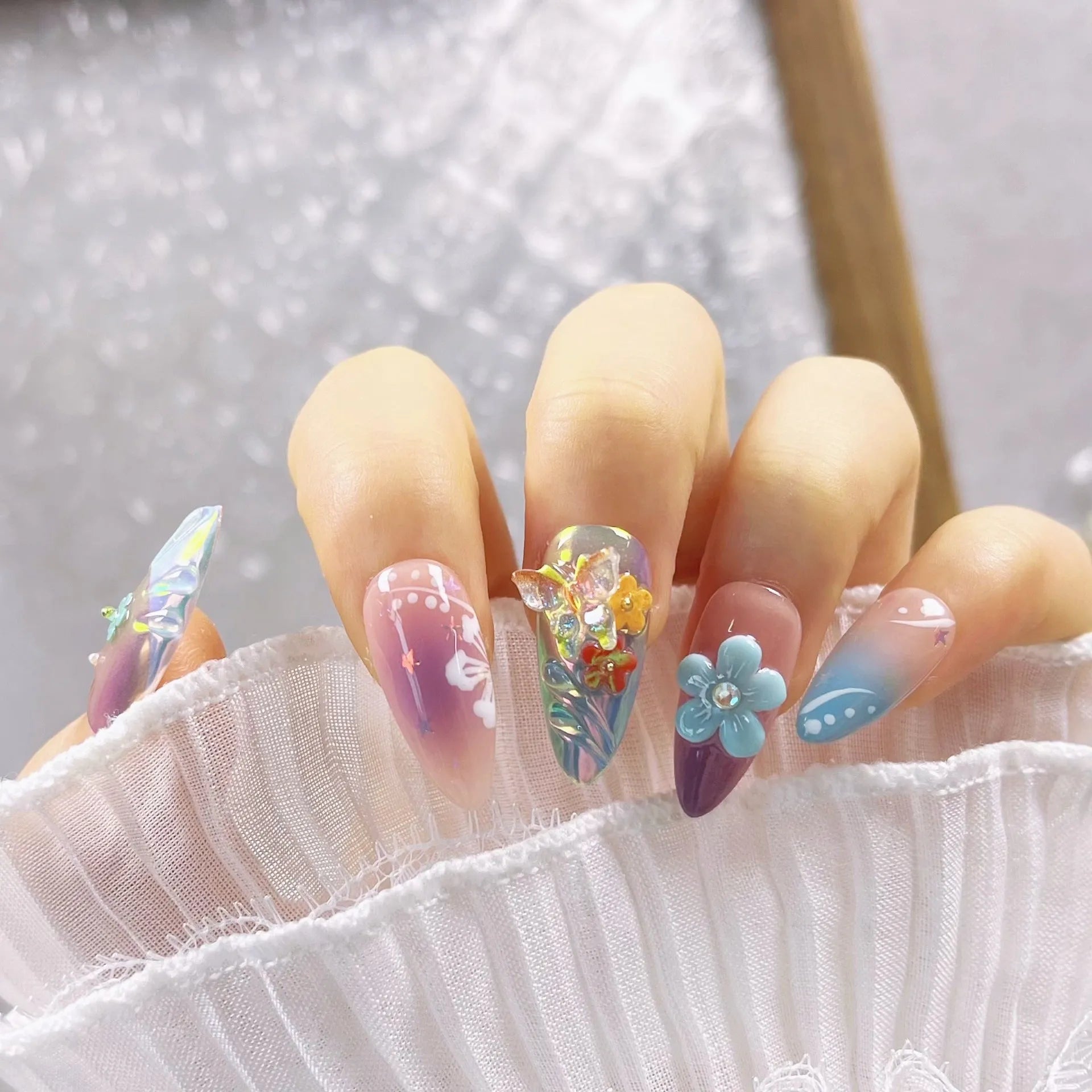 Handmade floral and butterfly nail art sculptures in four sizes for 3D manicure decorations