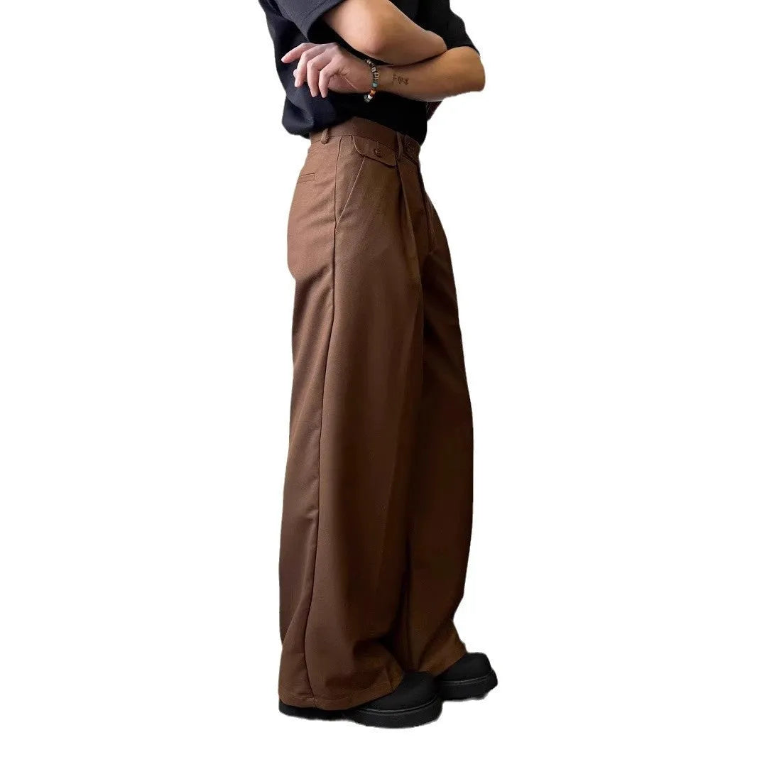 Men's straight-leg wide-leg casual trousers in black, showing loose fit and draping fabric.