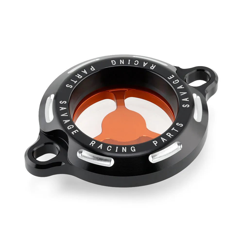 Aluminium alloy transparent oil filter cover for KTM DUKE motorcycles on a workbench