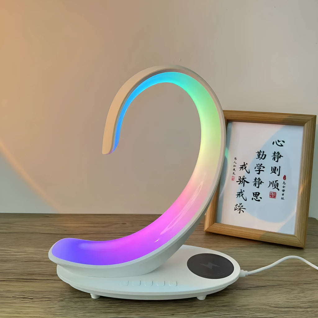 White swan decorative desk lamp with colourful RGB lighting, Bluetooth speaker, and wireless charging pad