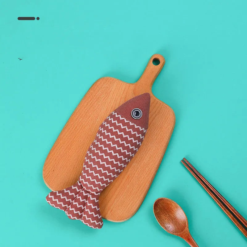 Set of three linen fish cat biting toys in navy blue, red, and yellow. Each measures 21x9x5cm.