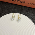 Platinum colour leaf earrings with shiny inlaid zircon stones