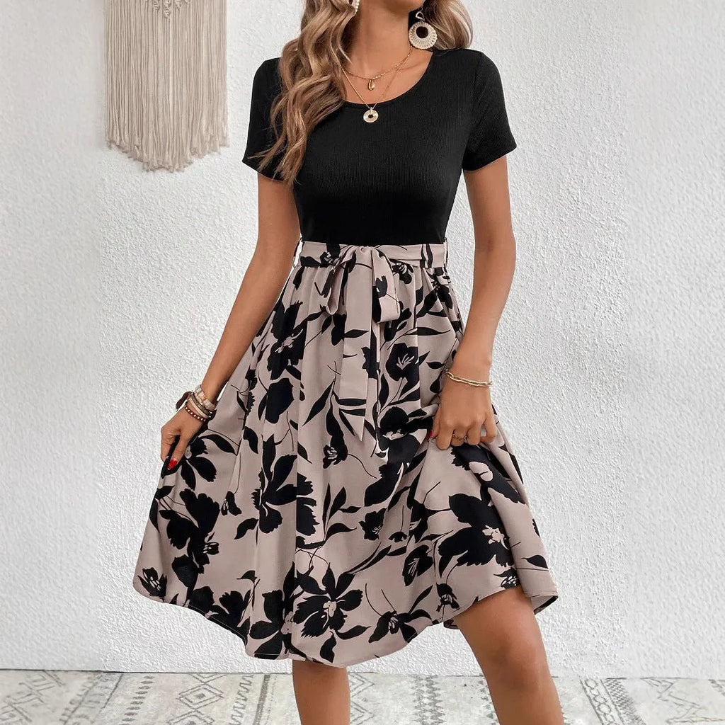 Khaki women's A-line dress with a floral print pattern and a lace-up shoulder strap detail.