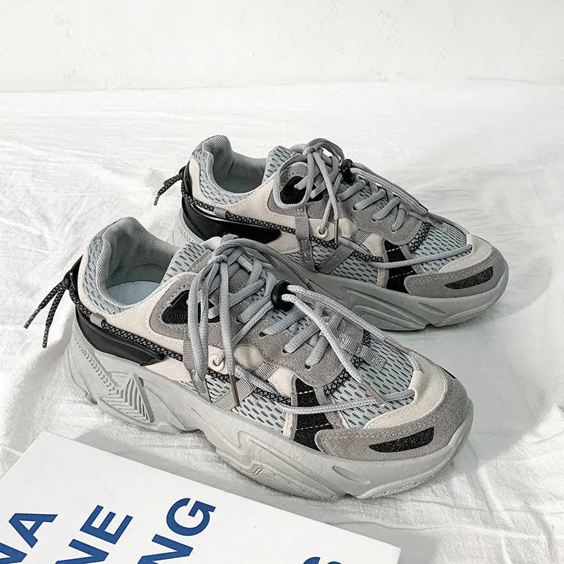 Men's white Korean-style platform dad shoes with thick sole and lace-up front on a plain background