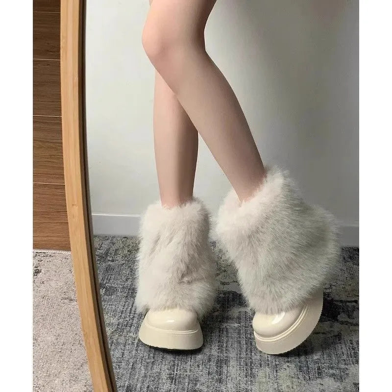Women's black fleece-lined snow boot with a round toe and mid rubber heel on a white background.