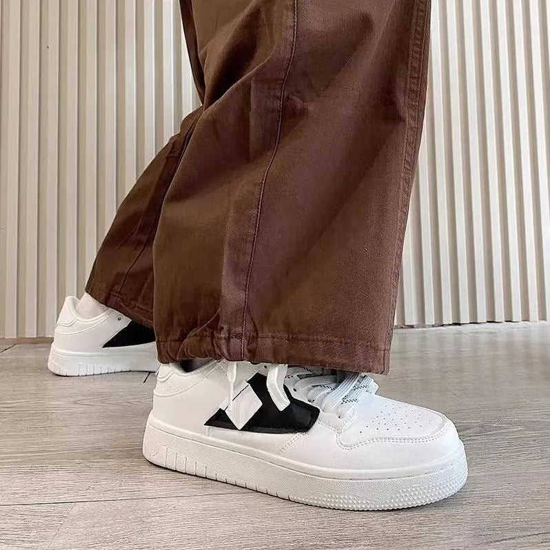 Low-top casual sneakers with synthetic leather upper, stitched detailing, and vulcanised rubber sole in white